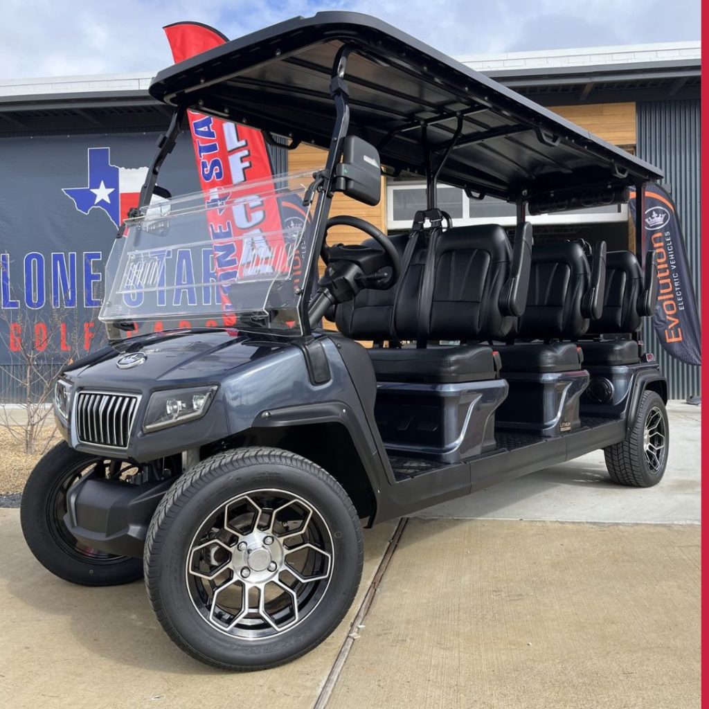 large 6 person golf cart outside dealership